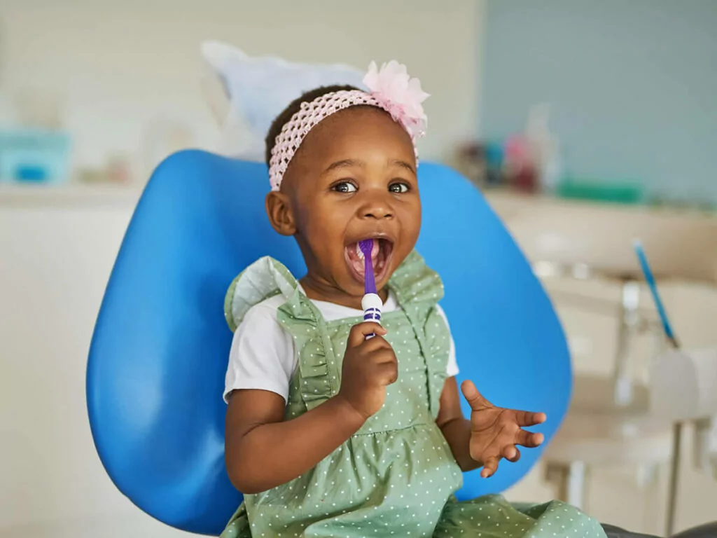 smiling baby at the dentist