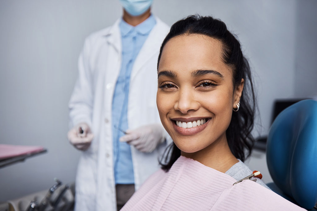 smiling woman in a dental chair